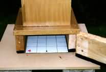 Picture of the bottom portion of the original 'GM' hive which shows the method of obtaining the weekly varroa drop count.